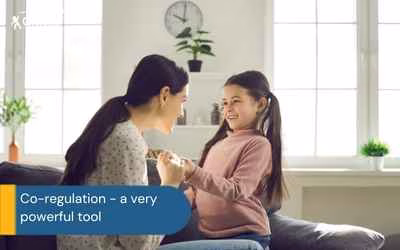 mother and child looking at each other smiling text co-regulation - a very powerful tool