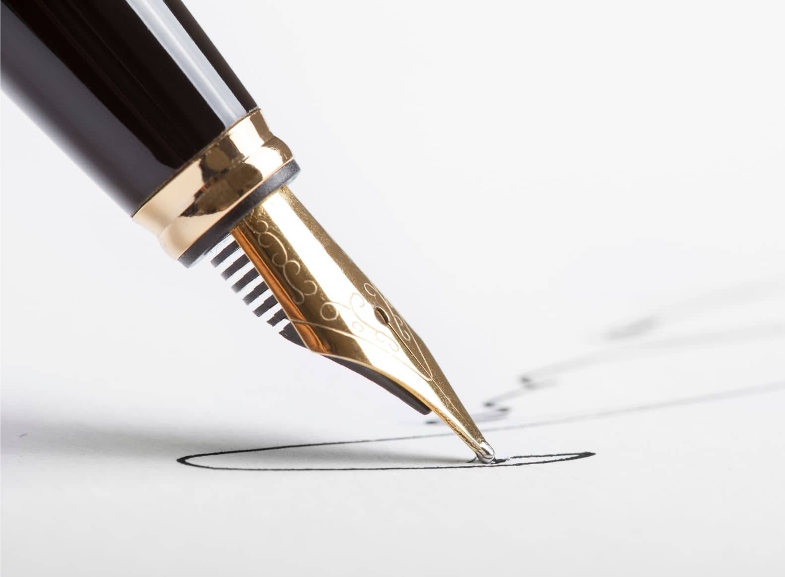 pen licences being written by calligraphy pen