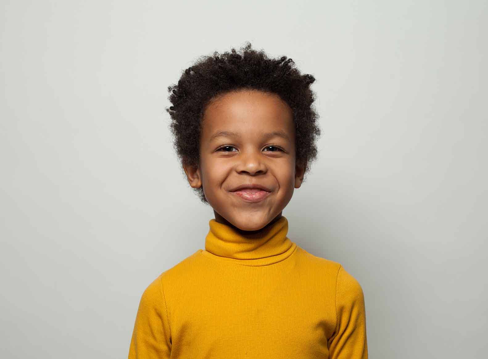 boy smiling directly at camera sensory strategies in the classroom